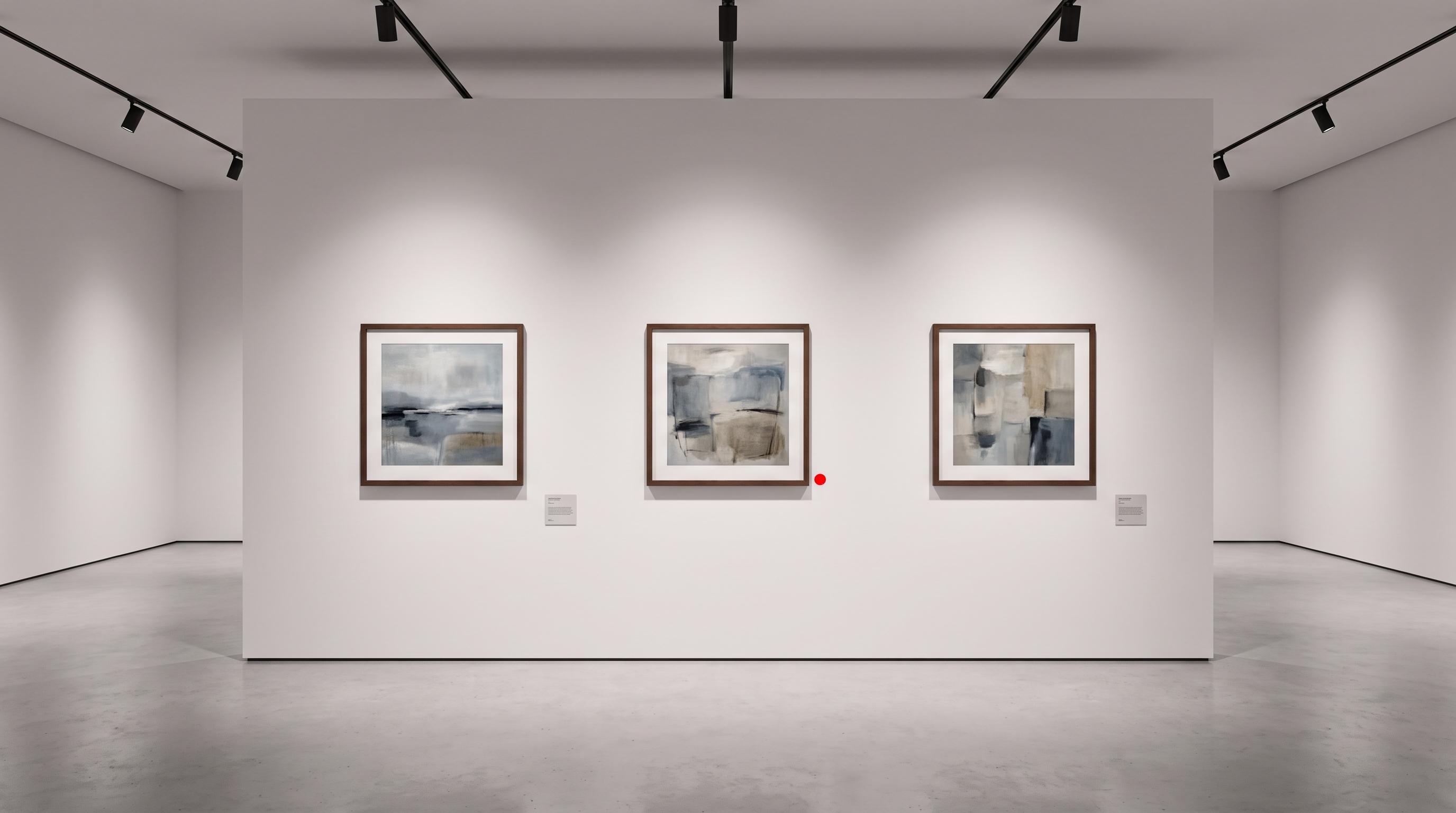 Minimalist white-walled gallery interior with three framed original paintings under soft track lighting